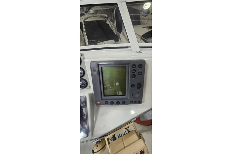 Slide: The Image of Raytheon navigation system on 1999 Carver 326 Aft Cabin Motor Yacht dashboard. - 12