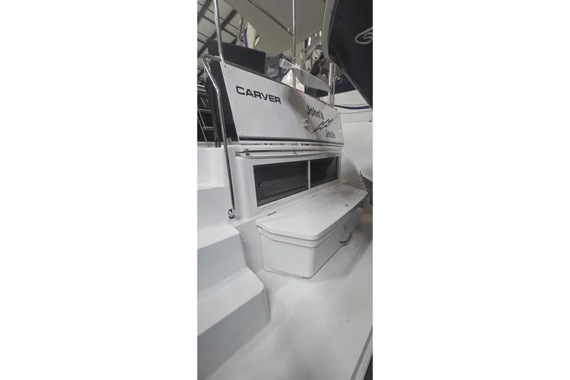 Slide: The Image of 1999 Carver 326 Aft Cabin Motor Yacht, rear view with steps and storage compartment. - 18