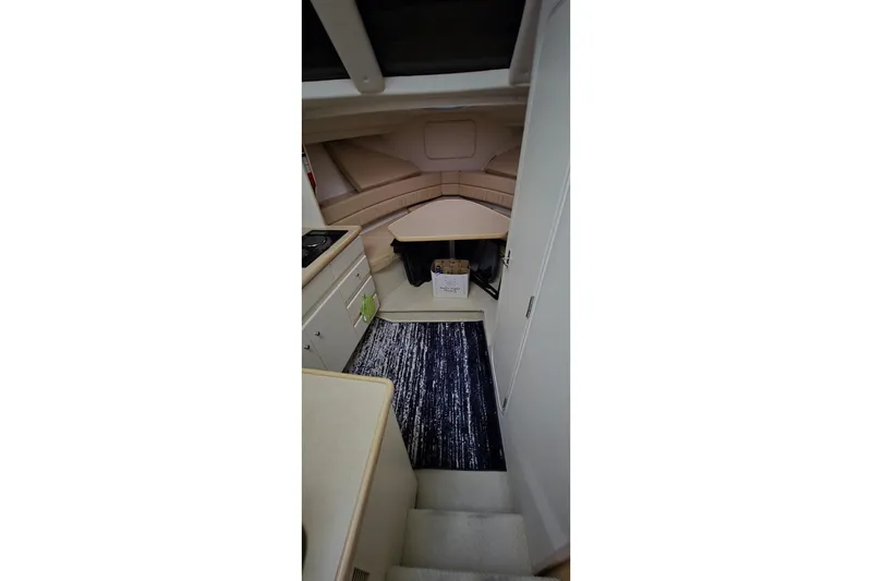 Slide: The Image of Interior of 1999 Carver 326 Aft Cabin Motor Yacht with kitchenette and seating area. - 20