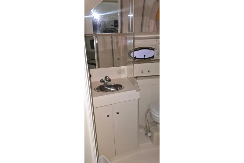 Slide: The Image of Bathroom interior of 1999 Carver 326 Aft Cabin Motor Yacht with sink and mirror. - 27