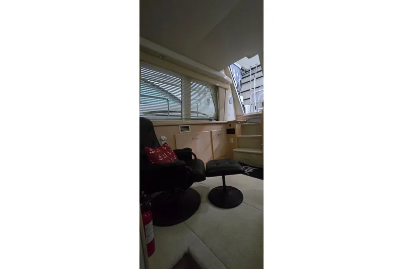 Slide: The Image of Interior of 1999 Carver 326 Aft Cabin Motor Yacht with seating and stairs. - 29