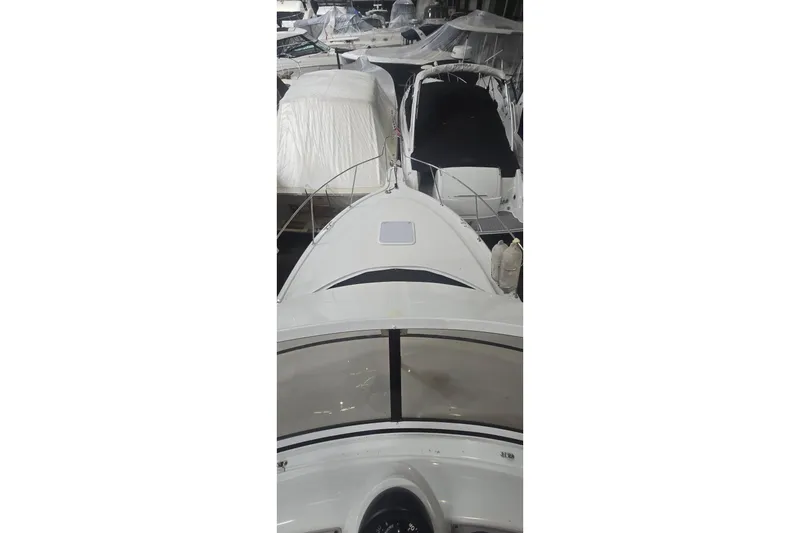 Slide: The Image of 1999 Carver 326 Aft Cabin Motor Yacht docked among other boats. - 3
