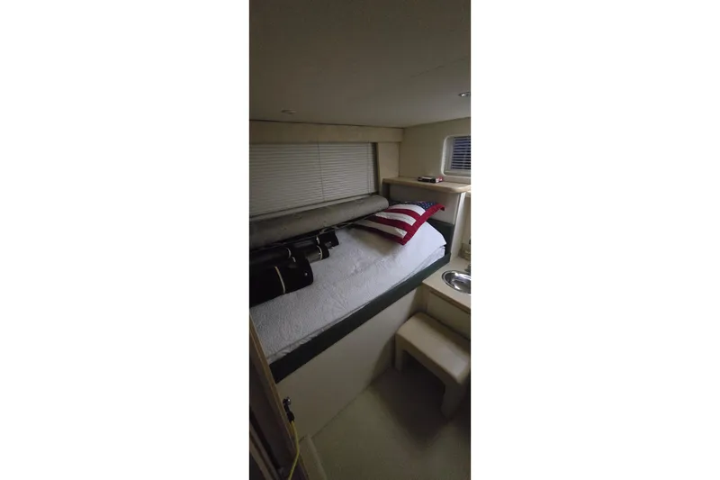 Slide: The Image of 1999 Carver 326 Aft Cabin Motor Yacht interior cabin with bed and window. - 34