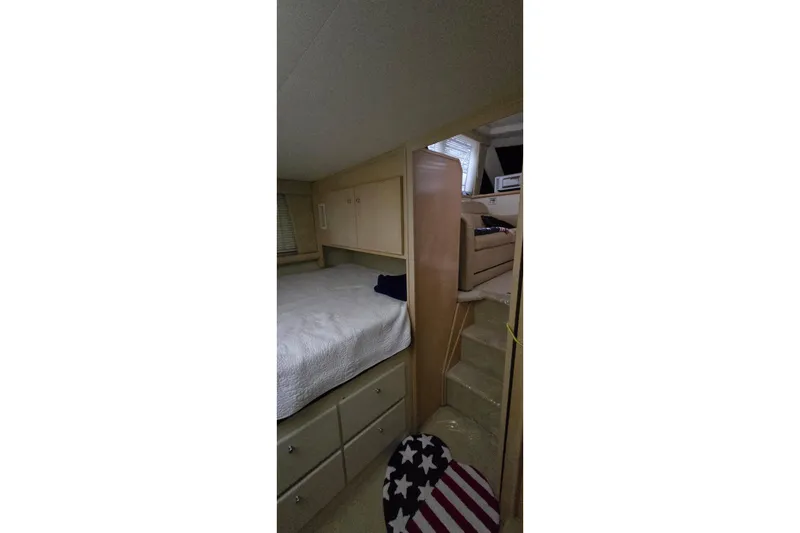 Slide: The Image of Interior of 1999 Carver 326 Aft Cabin Motor Yacht with bed and stairs. - 37