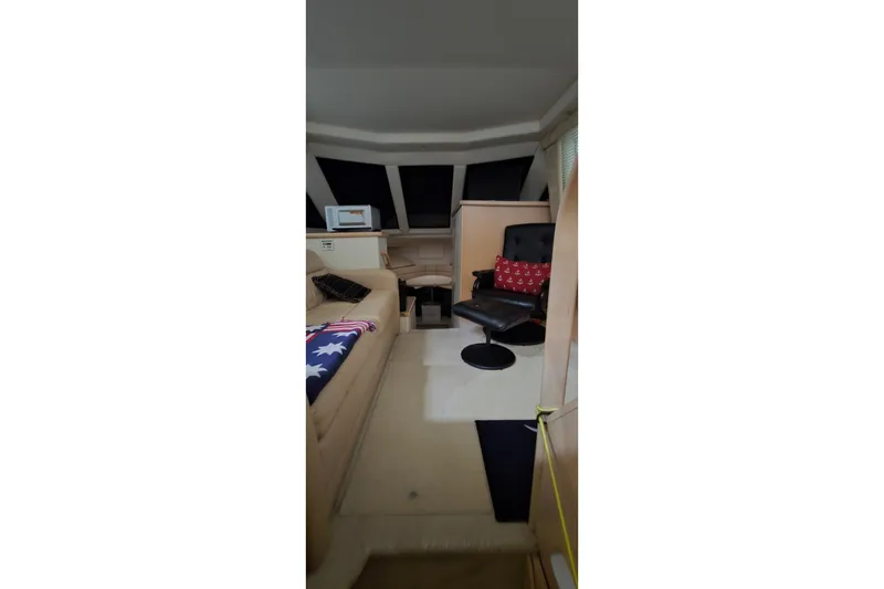 Slide: The Image of Interior of 1999 Carver 326 Aft Cabin Motor Yacht with seating and decor. - 39