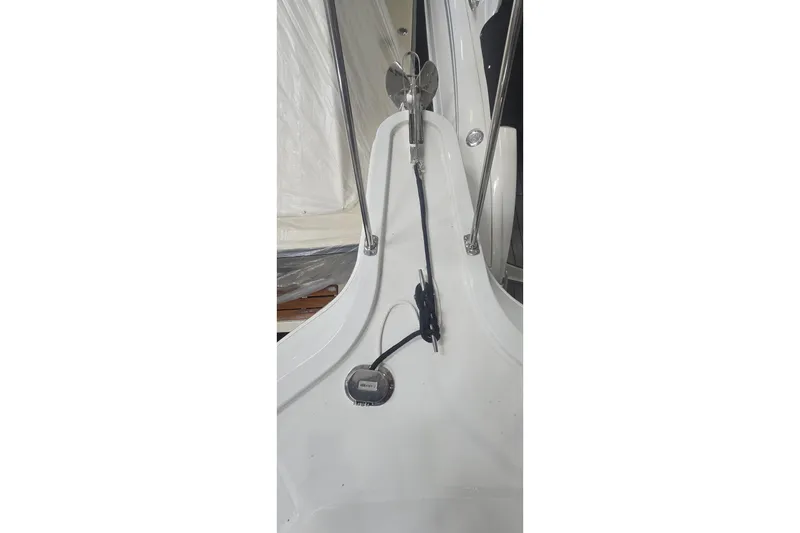 Slide: The Image of 1999 Carver 326 Aft Cabin Motor Yacht deck with anchor and rope details. - 4