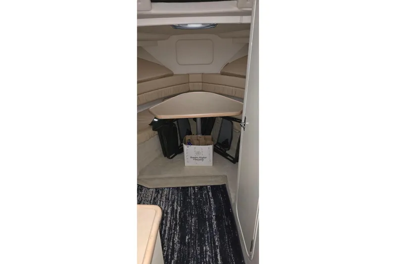 Slide: The Image of Interior cabin of 1999 Carver 326 Aft Cabin Motor Yacht with seating and table. - 40