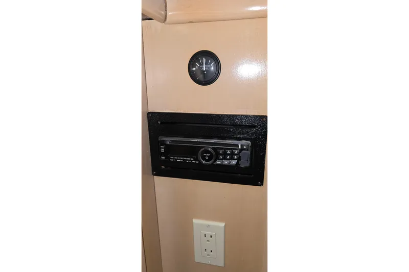 Slide: The Image of 1999 Carver 326 Aft Cabin Motor Yacht interior with stereo and outlet. - 45