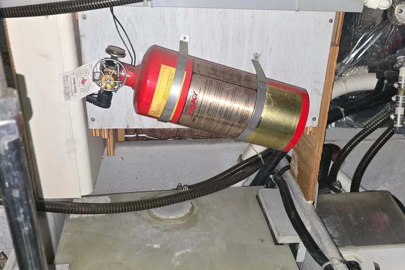Slide: The Image of Fire extinguisher mounted in 1999 Carver 326 Aft Cabin Motor Yacht engine room. - 46