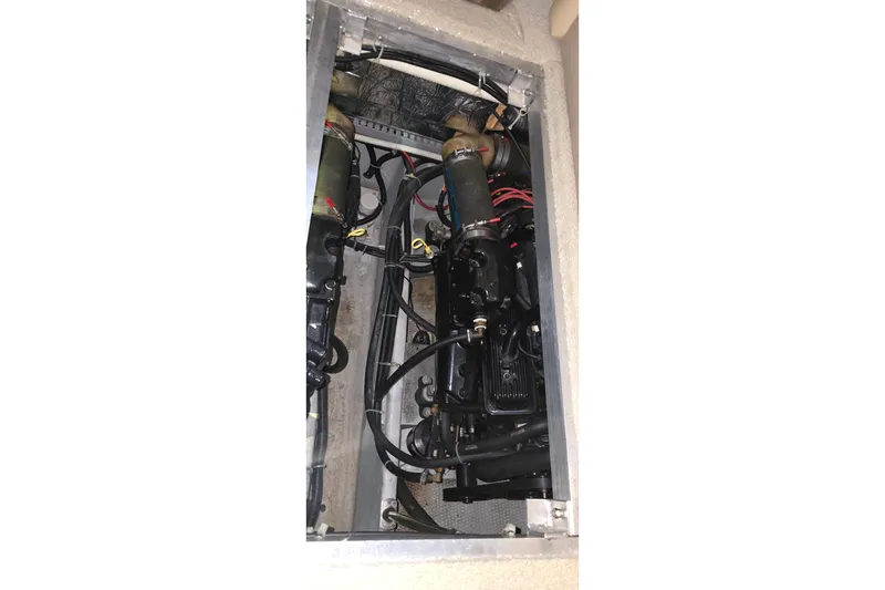 Slide: The Image of Engine compartment of 1999 Carver 326 Aft Cabin Motor Yacht, showing mechanical components. - 49