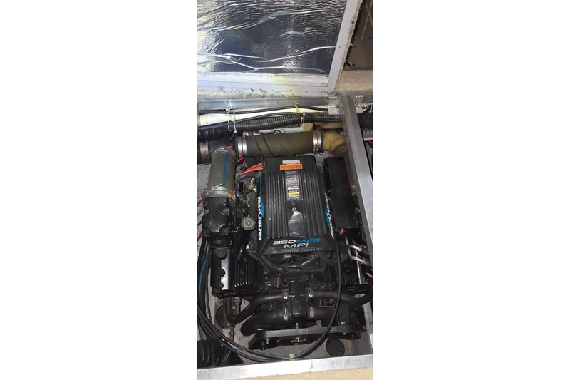 Slide: The Image of Engine compartment of 1999 Carver 326 Aft Cabin Motor Yacht, featuring MerCruiser engine. - 50