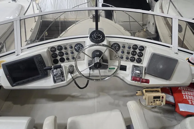 Slide: The Image of Helm of 1999 Carver 326 Aft Cabin Motor Yacht with navigation instruments and controls. - 7