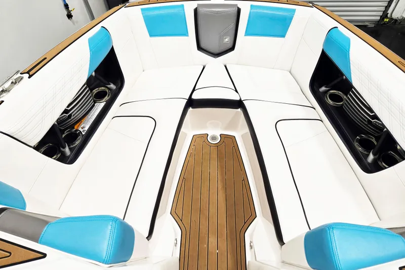 Slide: The Image of Interior of 2017 Nautique Super Air Nautique G23 boat with white and blue seating. - 14