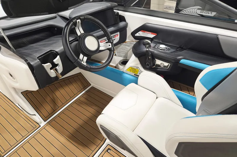 Slide: The Image of 2017 Nautique Super Air Nautique G23 cockpit with modern steering and seating. - 15
