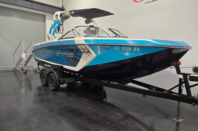 Slide: The Image of 2017 Nautique Super Air Nautique G23 boat on trailer in showroom. - 5