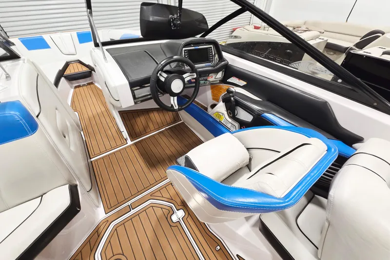 The Image of 2017 Nautique Super Air Nautique G23 interior with sleek dashboard and luxurious seating. - 7