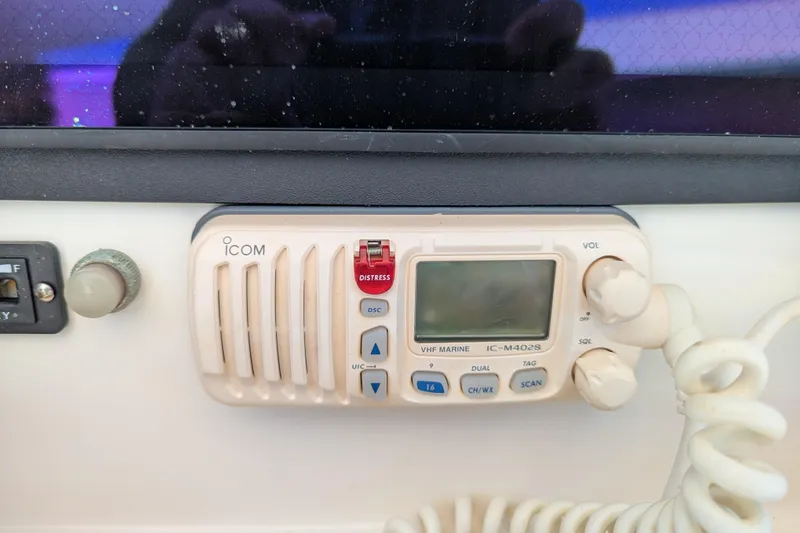 Slide: The Image of 2005 SeaVee 290B electronics panel with Simrad, Raymarine, and Fusion systems. - 11