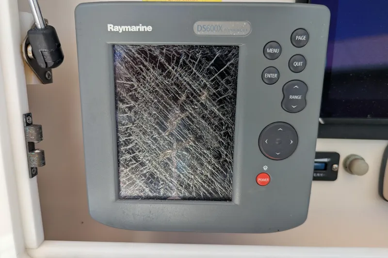 Slide: The Image of Cracked Raymarine DS600X display on 2005 SeaVee 290B boat dashboard. - 12