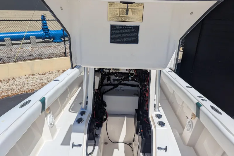 Slide: The Image of 2005 SeaVee 290B boat interior showing open hatch and wiring components. - 16