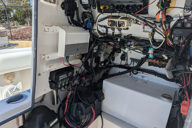 Slide: The Image of 2005 SeaVee 290B boat wiring and electrical components in the control panel area. - 18