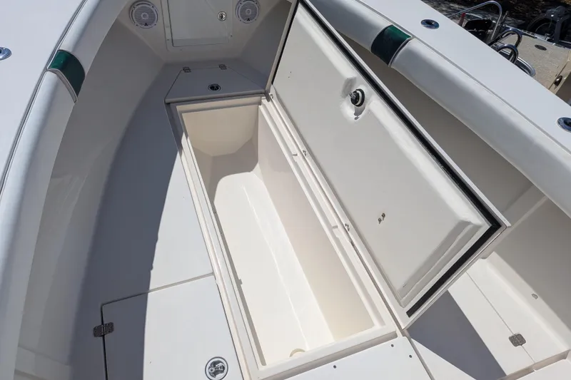Slide: The Image of Open storage compartment on a 2005 SeaVee 290B boat deck. - 21