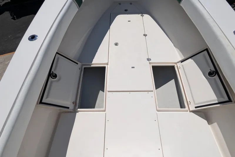 Slide: The Image of 2005 SeaVee 290B boat deck with open storage compartments. - 22