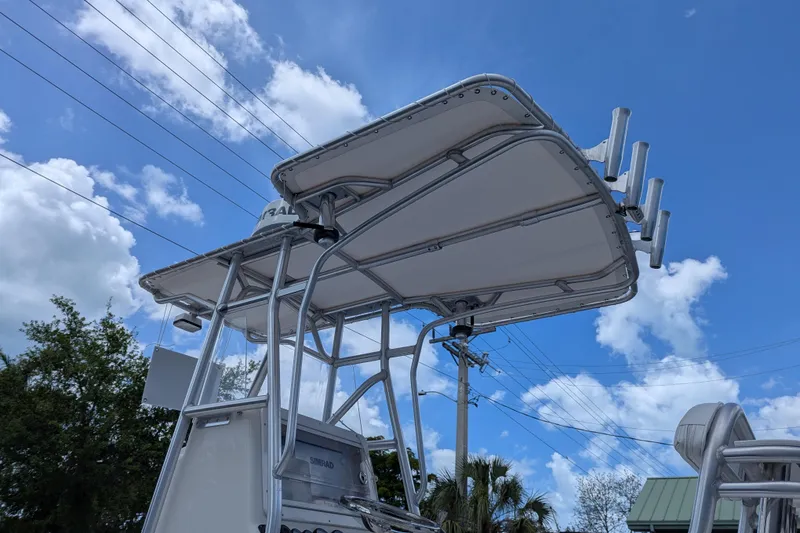 Slide: The Image of 2005 SeaVee 290B boat with T-top against a blue sky and clouds. - 26