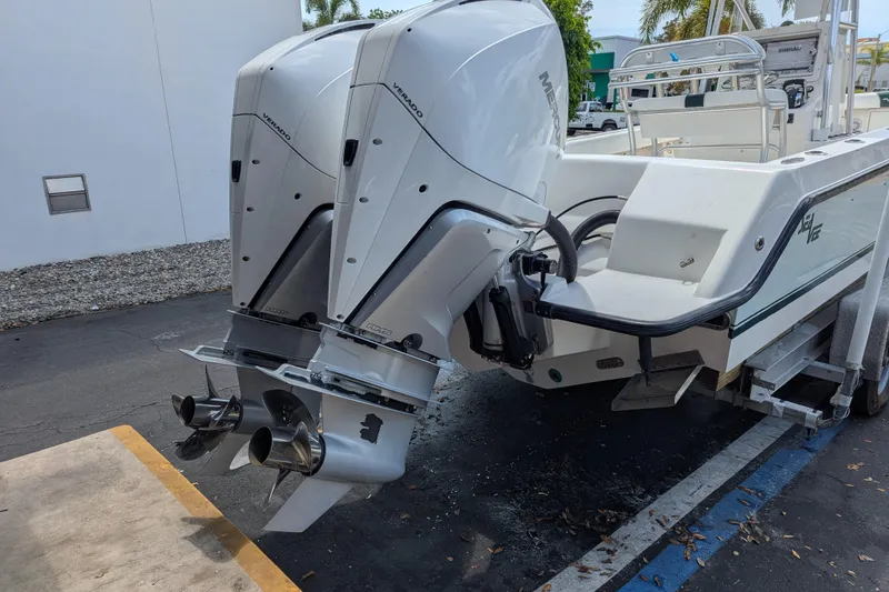 Slide: The Image of 2005 SeaVee 290B boat with dual Mercury Verado outboard engines on a trailer. - 30