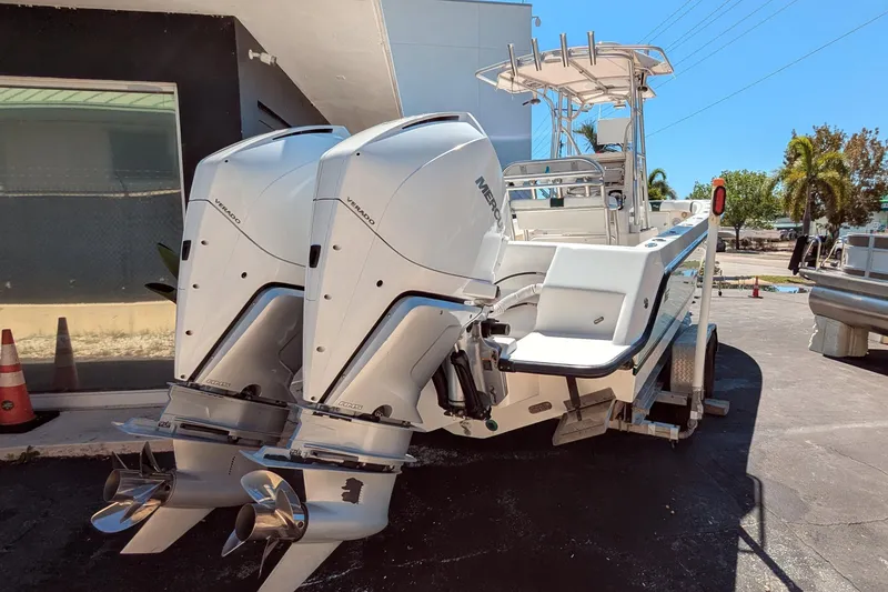 Slide: The Image of 2005 SeaVee 290B boat with dual Mercury Verado engines on a trailer. - 4