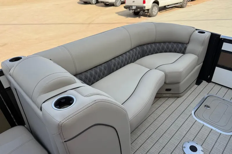 Slide: The Image of Luxurious seating on 2022 Barletta LUSSO 25UEA pontoon boat with cup holders. - 11