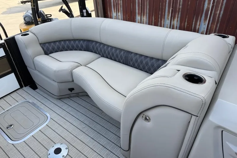 Slide: The Image of Luxurious seating on 2022 Barletta LUSSO 25UEA pontoon boat with cup holders and elegant design. - 12