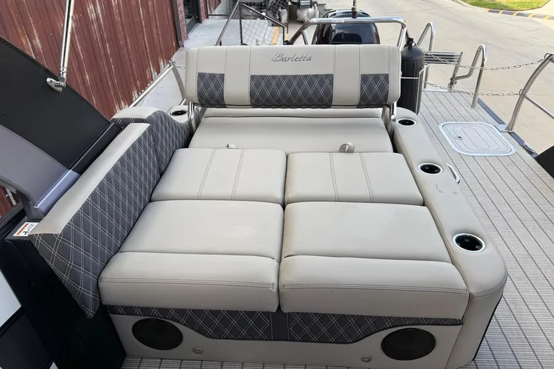 Slide: The Image of Luxurious seating on 2022 Barletta LUSSO 25UEA pontoon boat with cup holders and stylish upholstery. - 19