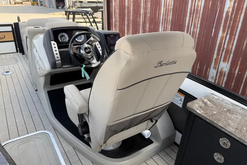 Slide: The Image of Captain's chair and dashboard of 2022 Barletta LUSSO 25UEA boat. - 8