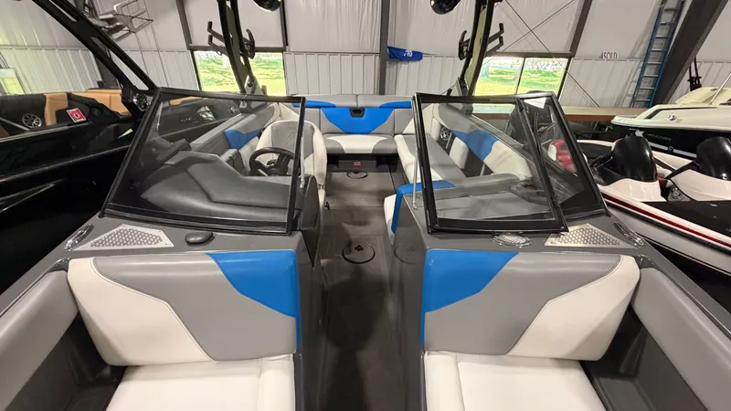Slide: The Image of The image shows the cockpit of a 2020 ATX Surf Boats 22 Type-S with blue and gray seating. - 40