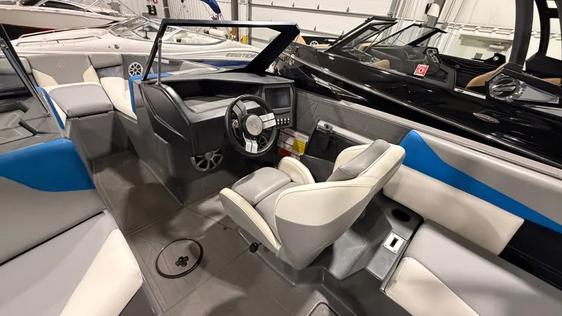 Slide: The Image of Interior of a 2020 ATX Surf Boats 22 Type-S with modern seating and control console. - 22