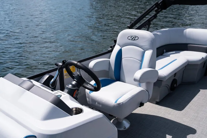 Slide: The Image of Manufacturer Provided Image: 2025 Bentley Pontoons Bolt 203 interior with luxurious seating and steering wheel on water. - 7