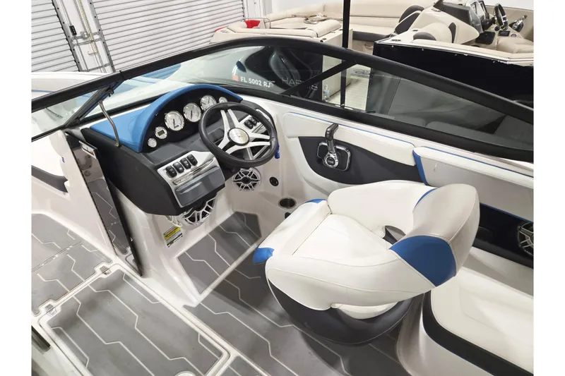 Slide: The Image of Interior of 2020 Regal 2000 ESX Bowrider boat with modern dashboard and seating. - 6