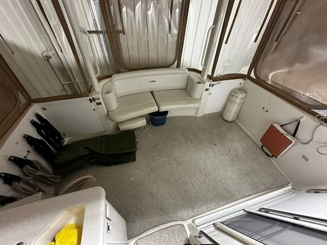 Slide: The Image of Interior of a 2002 Silverton 39 Motor Yacht with seating area. - 10