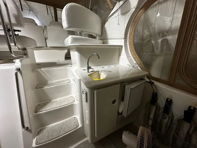 Slide: The Image of Interior of 2002 Silverton 39 Motor Yacht with sink and seating area. - 11