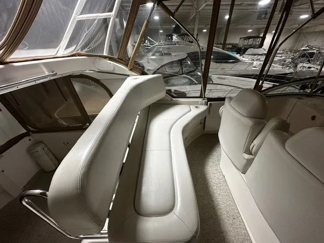 Slide: The Image of Interior of a 2002 Silverton 39 Motor Yacht with white leather seating. - 13