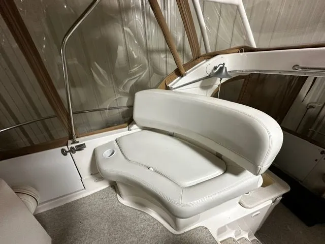 Slide: The Image of Interior of a 2002 Silverton 39 Motor Yacht with white seating. - 14