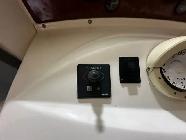 Slide: The Image of Control panel of 2002 Silverton 39 Motor Yacht with thruster control. - 16