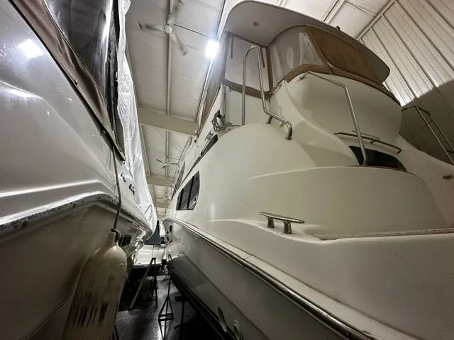 Slide: The Image of 2002 Silverton 39 Motor Yacht in storage facility. - 2
