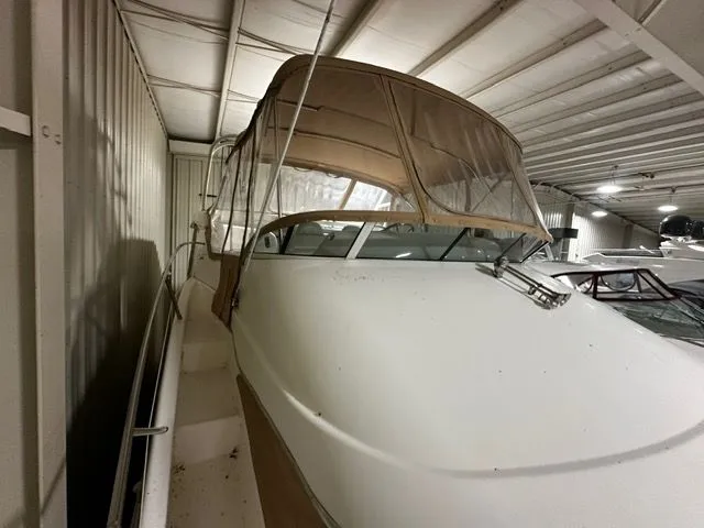 Slide: The Image of 2002 Silverton 39 Motor Yacht in storage facility, side view. - 21