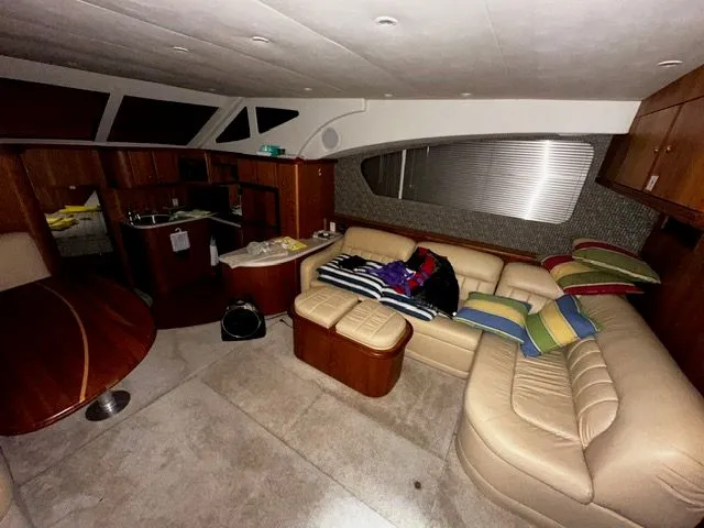 Slide: The Image of Interior of 2002 Silverton 39 Motor Yacht with leather sofa and kitchen. - 22