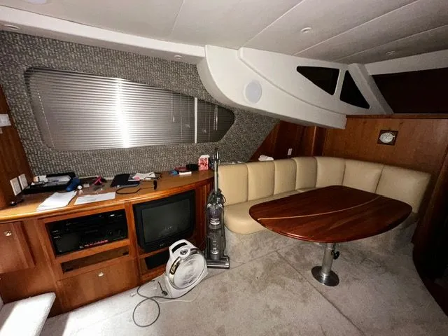 Slide: The Image of Interior of a 2002 Silverton 39 Motor Yacht with seating area and TV. - 23