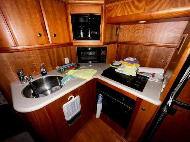 Slide: The Image of Kitchen area of the 2002 Silverton 39 Motor Yacht. - 25