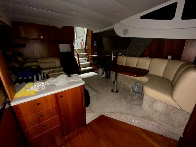 Slide: The Image of Interior of 2002 Silverton 39 Motor Yacht with cozy seating area. - 27