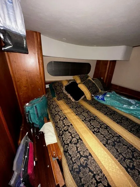 Slide: The Image of Interior of 2002 Silverton 39 Motor Yacht with luxurious bed. - 33