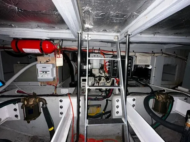 Slide: The Image of Engine room of 2002 Silverton 39 Motor Yacht with fire extinguisher. - 37
